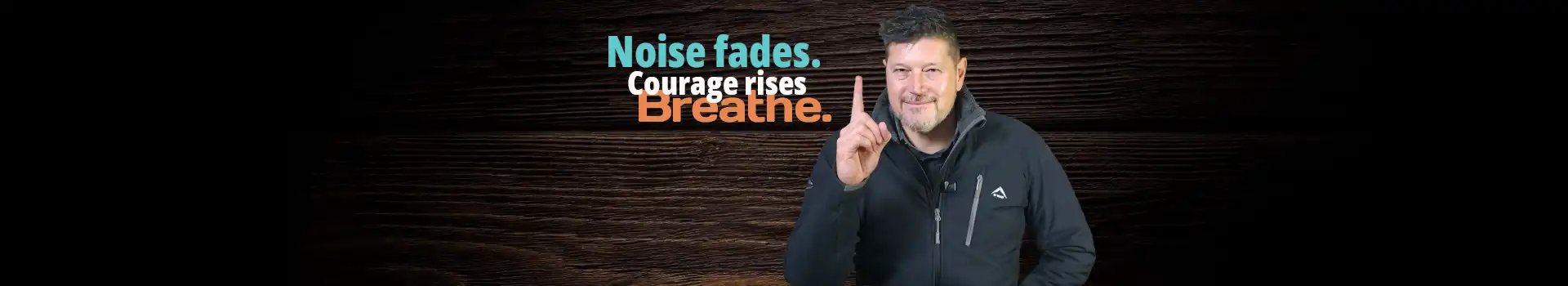 A Christian life coach standing confidently against a dark wooden background, pointing upward next to a quote about Biblical Encouragement: "Noise fades. Courage rises. Breathe."